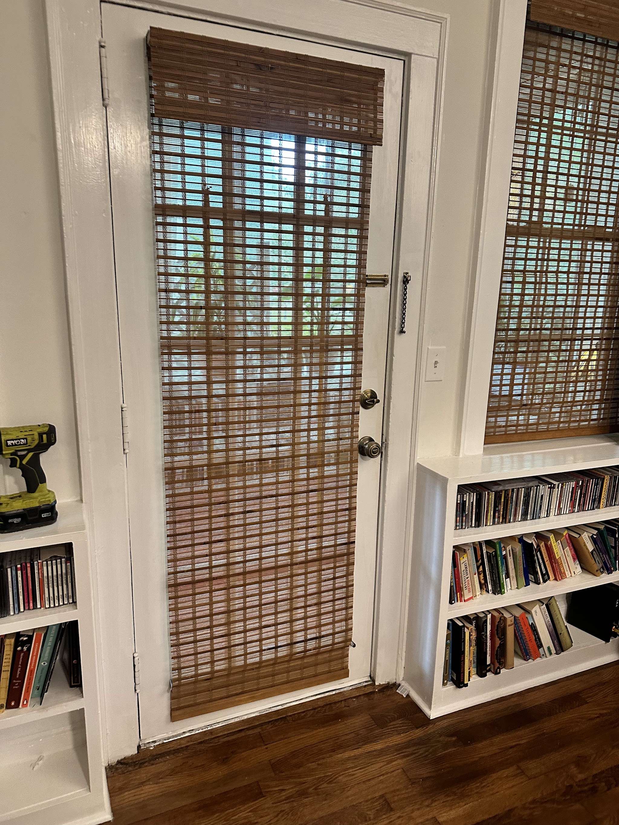 Woven bamboo shade fitted on a white door
